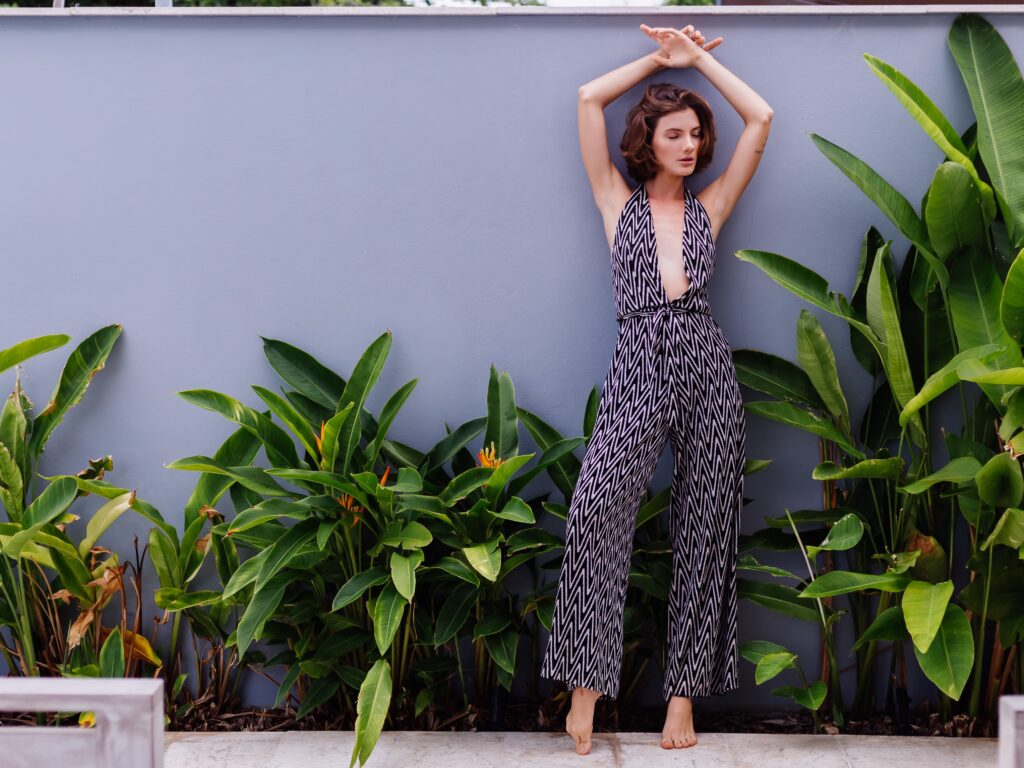 Vintage floral maxi dress from the '60s next to the modern jumpsuit, showcasing the DNA of vintage and modern styles for 2025 fashion.