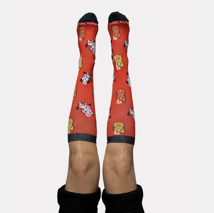 For professionals with a playful side, the Cats & Dogs Compression Socks are a crowd-pleaser. They’re a perfect gift for hospitality workers or first responders who love animals and need reliable leg support.
