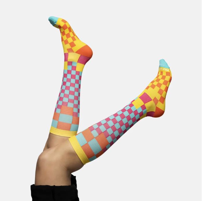 Athletes and fitness enthusiasts rave about the Checkered Compression Socks for their retro style and recovery benefits.