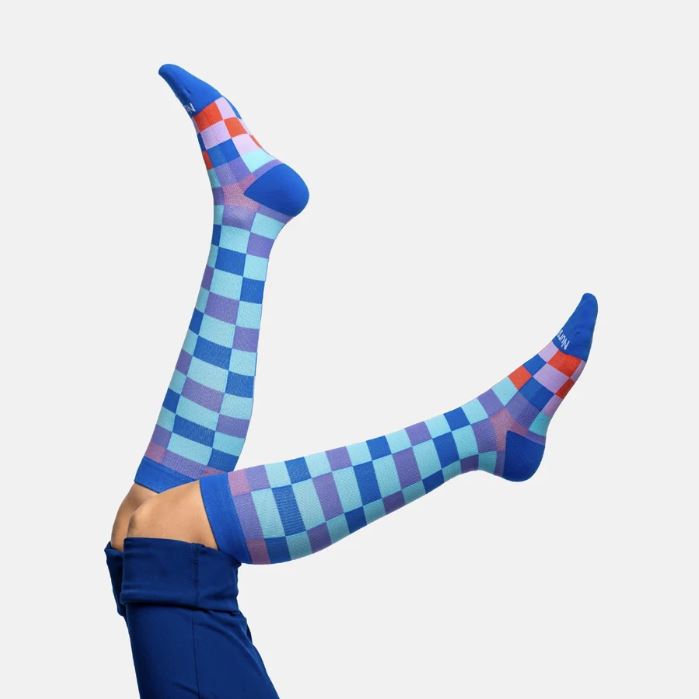 Athletes and fitness enthusiasts rave about the Checkered Compression Socks for their retro style and recovery benefits.