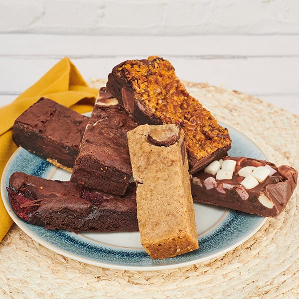 Their signature range includes the Classic Chocolate Brownie, Vegan Brownie, and Gluten-Free Blondie, each infused with a unique twist that elevates the dessert experience beyond the ordinary.