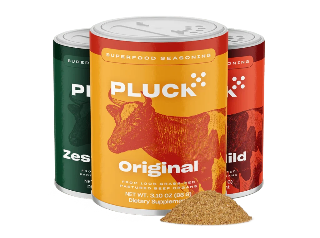 Pluck superfood seasoning jars in Original, Zesty, and Mild flavors, made from grass-fed beef organs with a pile of seasoning in front