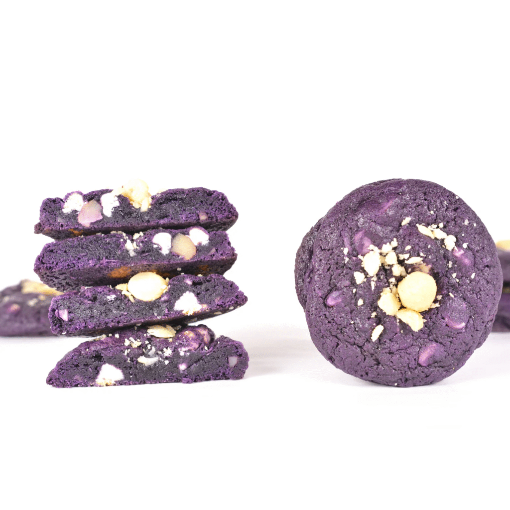 Ray's Cookies Chunky Ube Bae cookie with white chocolate and macadamia nuts in a vibrant purple ube base.